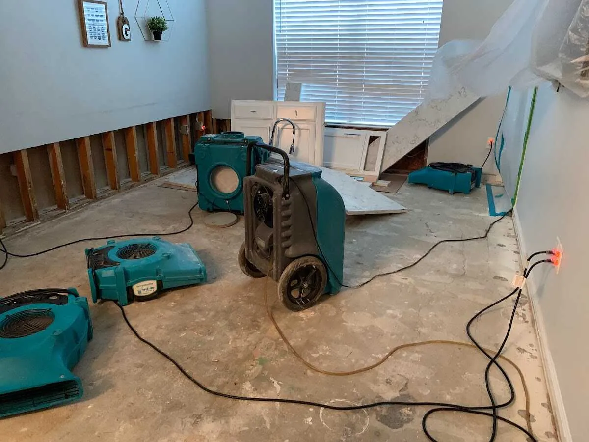Dehumidifier in flood-cut room for Water Damage Restoration in Lonsdale